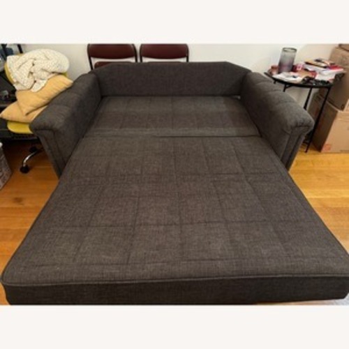Used Vintage/Antique Dark Brown Wood Sleeper Sofa for sale on AptDeco