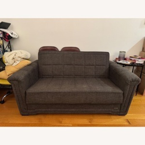 Used Vintage/Antique Dark Brown Wood Sleeper Sofa for sale on AptDeco